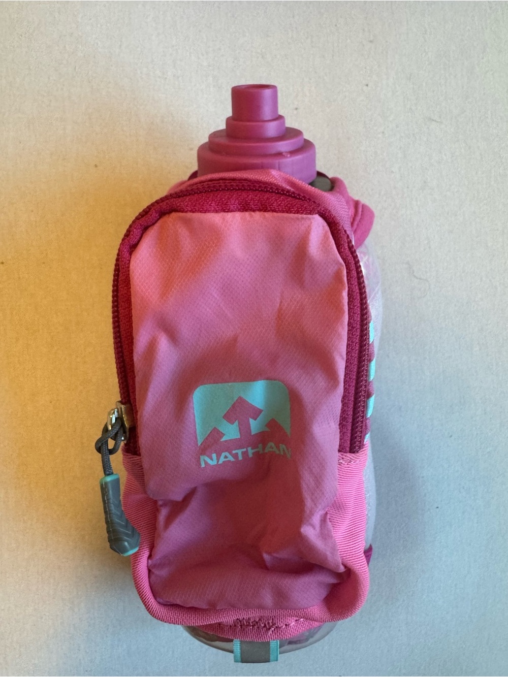 Nathan Handled Running Water Bottle with Zip Pocket Pink